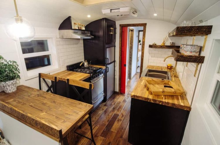 wind river school bus conversion company interior view of a kitchen in a skoolie